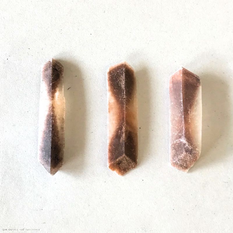 Hourglass Selenite is partially transparent. Sand creates the hourglass shape. - History By Mail