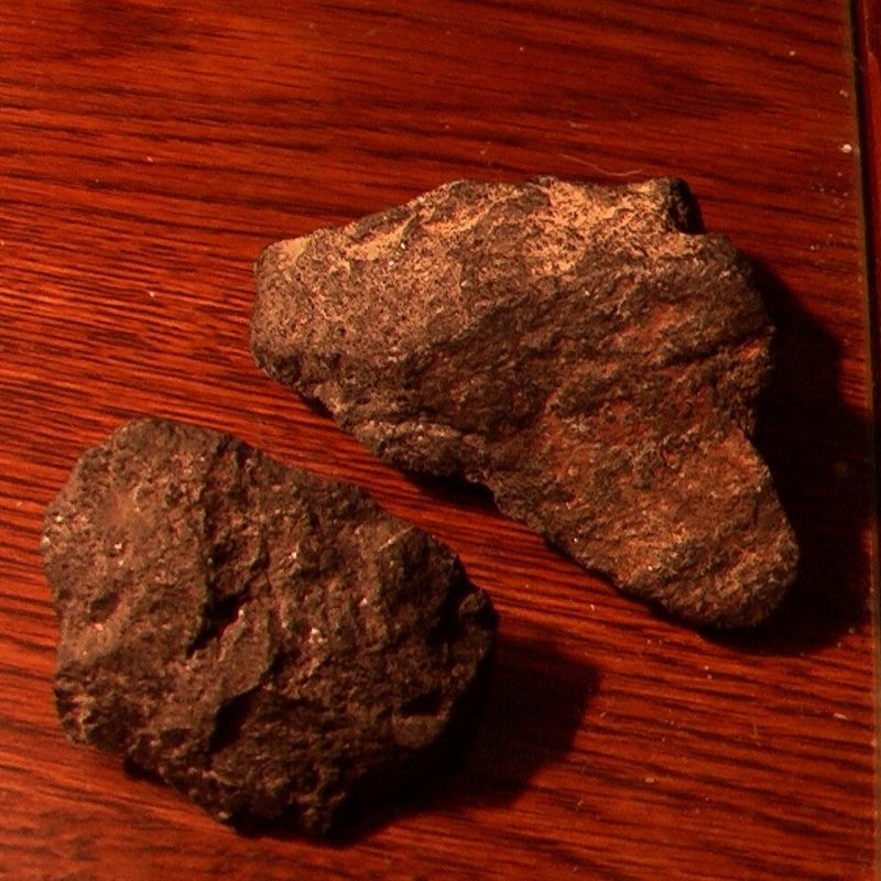 Cumberlandite weathers to a brownish black with white crystals. - History By Mail