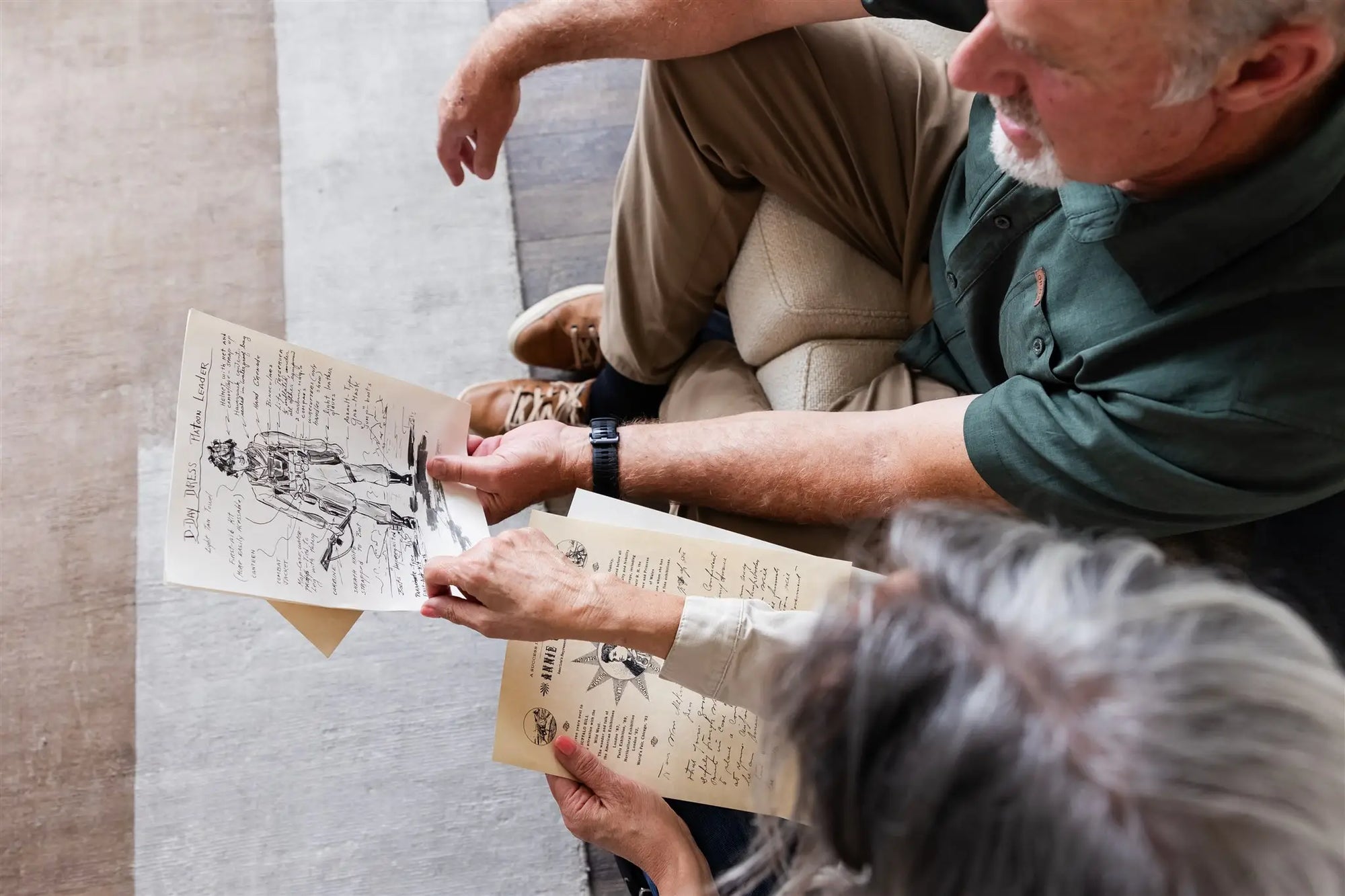 Couple holding a D-Day and Annie Oakley replica
