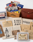History By Mail Deluxe History Bundle featuring replica historical letters and documents, historic cartoon cards, History By The Glass, wooden display box, and keepsake folio.