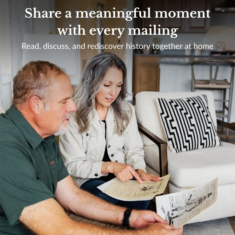 Couple looking at D-Day Sketch and Letter from Annie Oakley