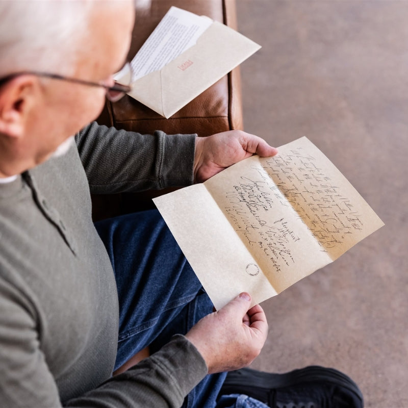Man holding a History By Mail replica letter