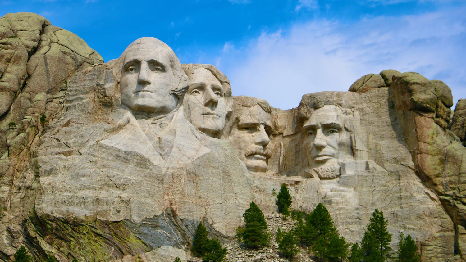 A rock carving of the faces of four U.S. presidents in Keystone, South Dakota. - History By Mail