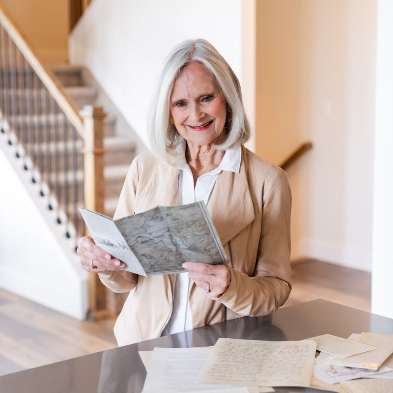 Woman holding a Yellowstone Brochure