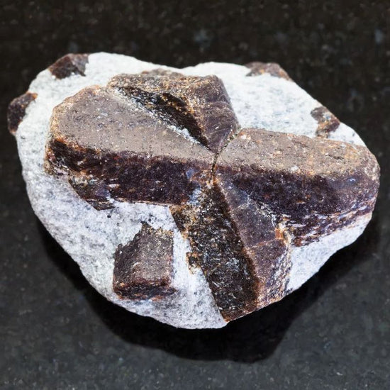 Staurolite is a reddish brown to black, mostly opaque, nesosilicate mineral with a white streak. - History By Mail