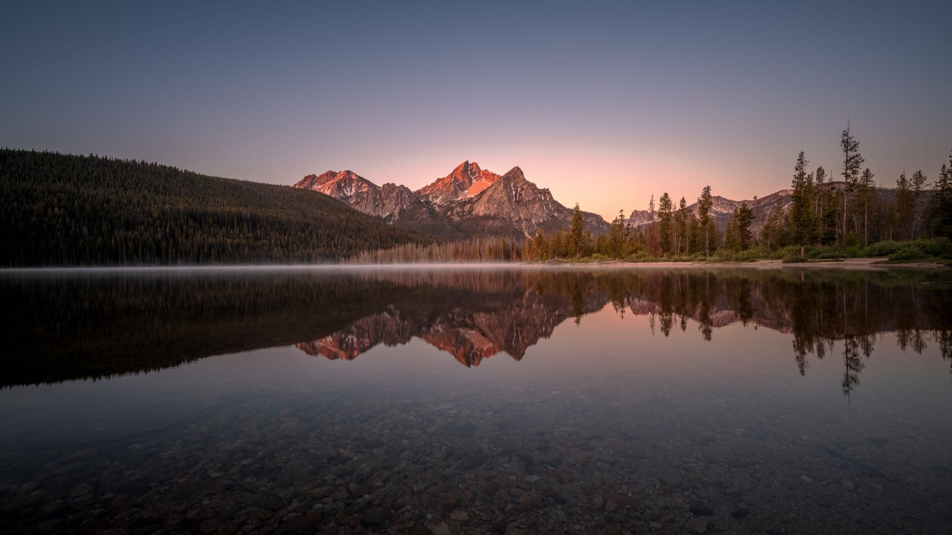 View of Sawtooth Range with reflection on the water in Idaho - History By Mail