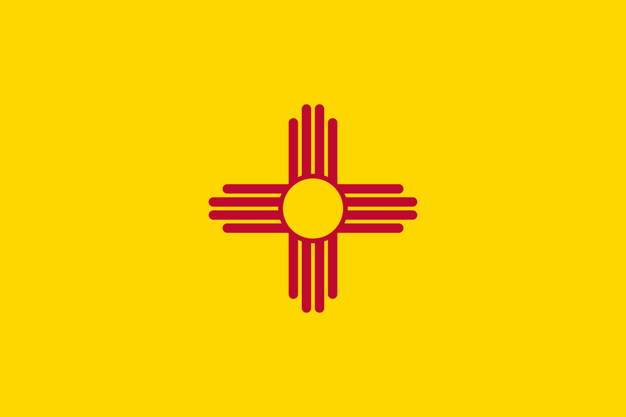 The official state flag of New Mexico was adopted in 1925 and features the ancient Zia sun symbol in red on a field of yellow. - History By Mail
