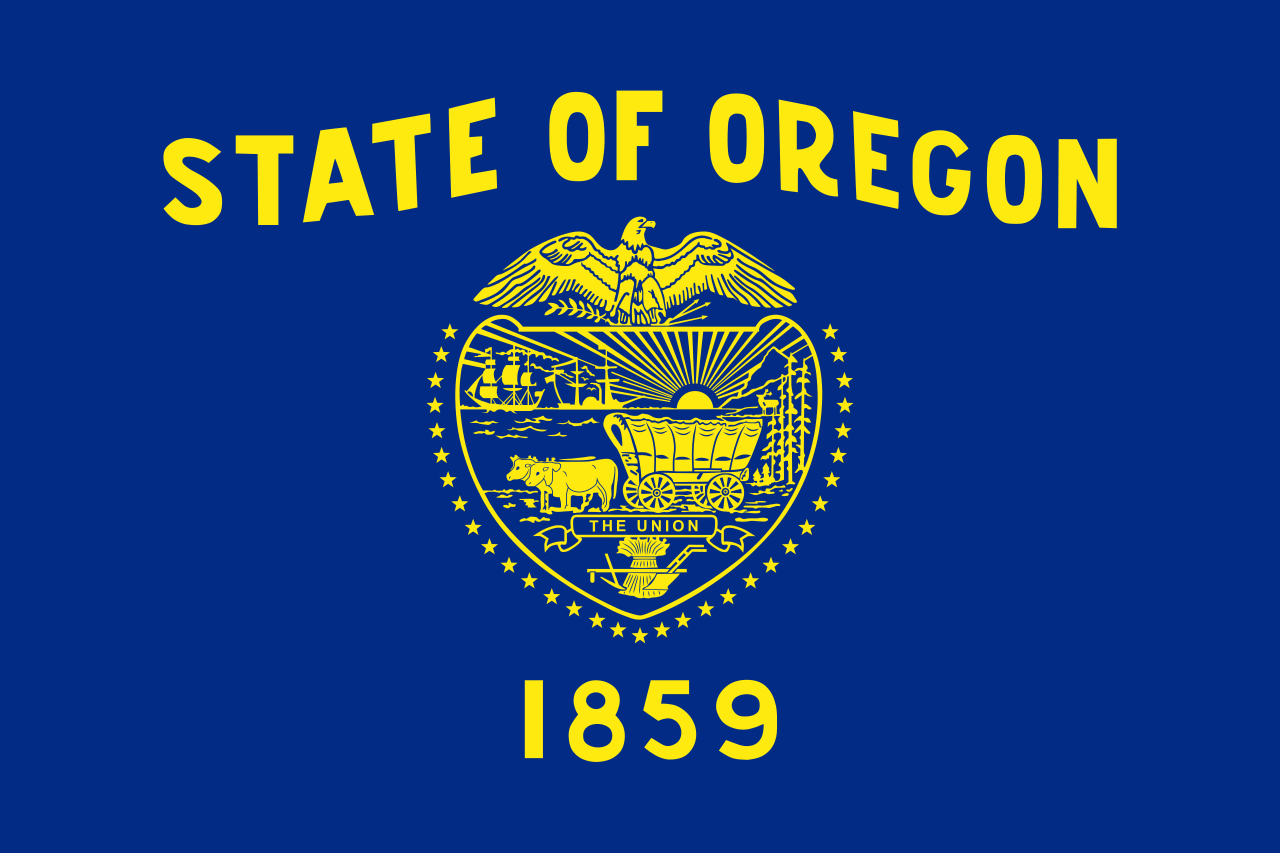 The official state flag of Oregon was adopted in 1925 and showcases a state seal in gold on a navy blue field. - History By Mail